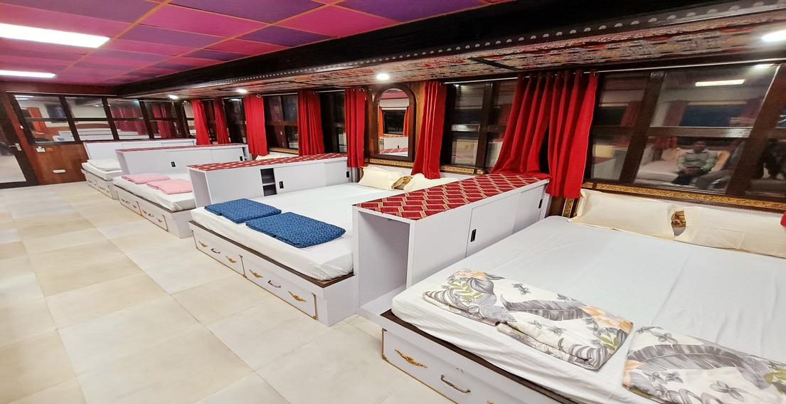 Spacious common area in the Boys Dormitory at House of Sheherwali Hotel, Azimganj, designed for relaxation and socializing