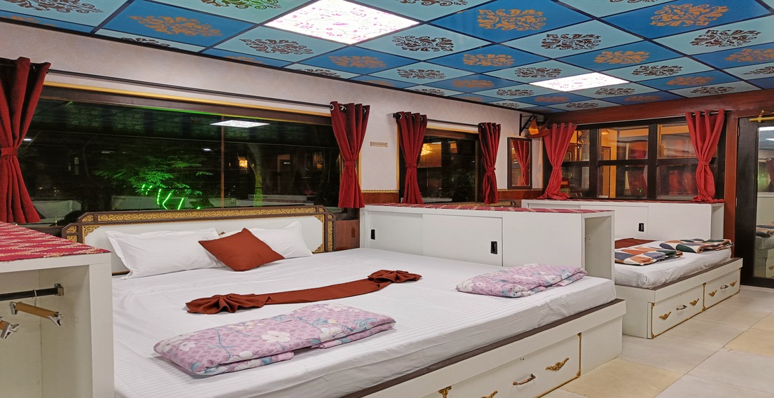 Cozy lounge interior of the Boys Dormitory at House of Sheherwali Hotel in Azimganj, designed for relaxation and socializing