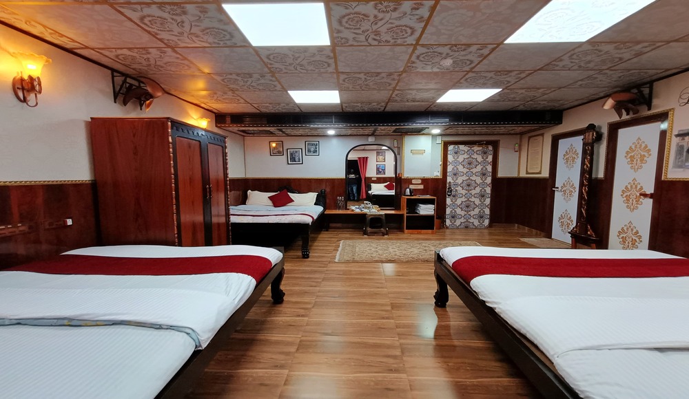 Luxurious and comfortable bedding in Dugars Room at House of Sheherwali Hotel, Azimganj
