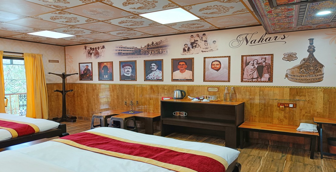 Nahars Room at House of Sheherwali, featuring a wall adorned with historic paintings of the Nahar family