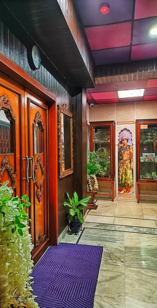 Hotel corridor at House of Sheherwali showcasing historic Sheherwali paintings and heritage in Azimganj