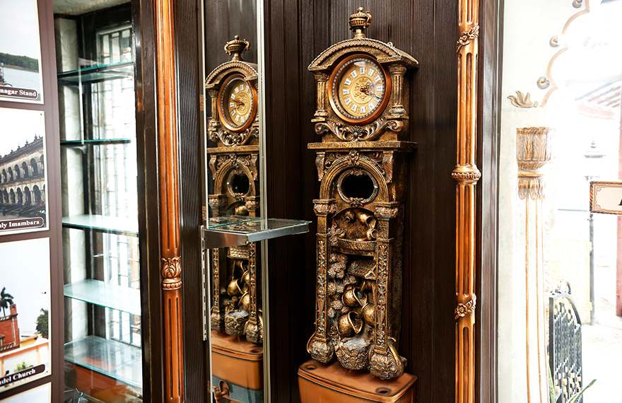 Exhibit of the first grandfather clock at House of Sheherwali in Azimganj, designed by William Clement in 1670, showcasing its tall, freestanding design and decorative elegance.