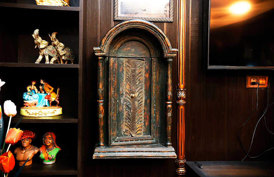 A stunning display of Rajasthani-style furniture at House of Sheherwali, featuring intricate woodwork inspired by traditional Jharokas.