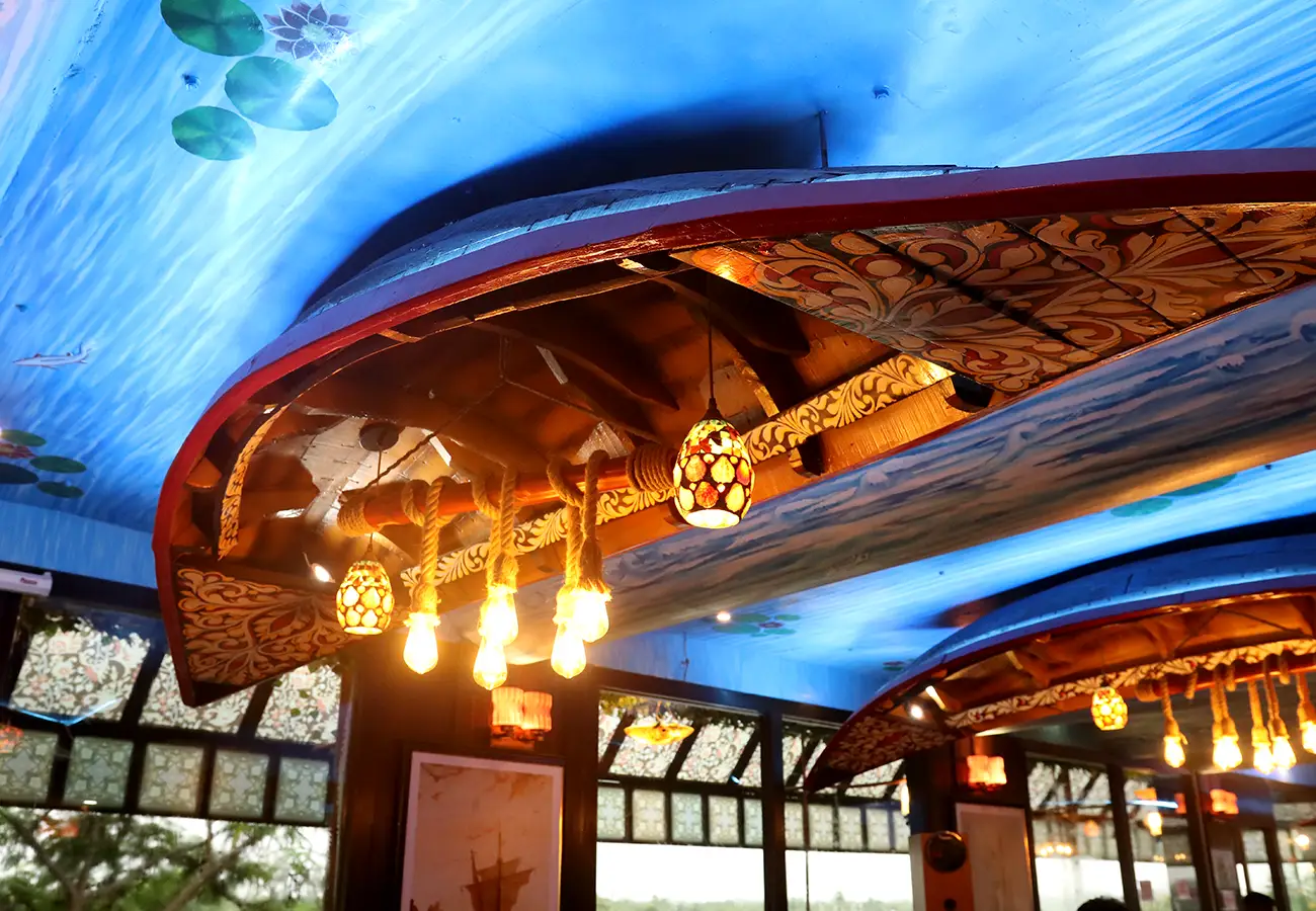 Exterior view of House of Sheherwali's boat-themed restaurant in Azimganj, featuring décor inspired by historic boats