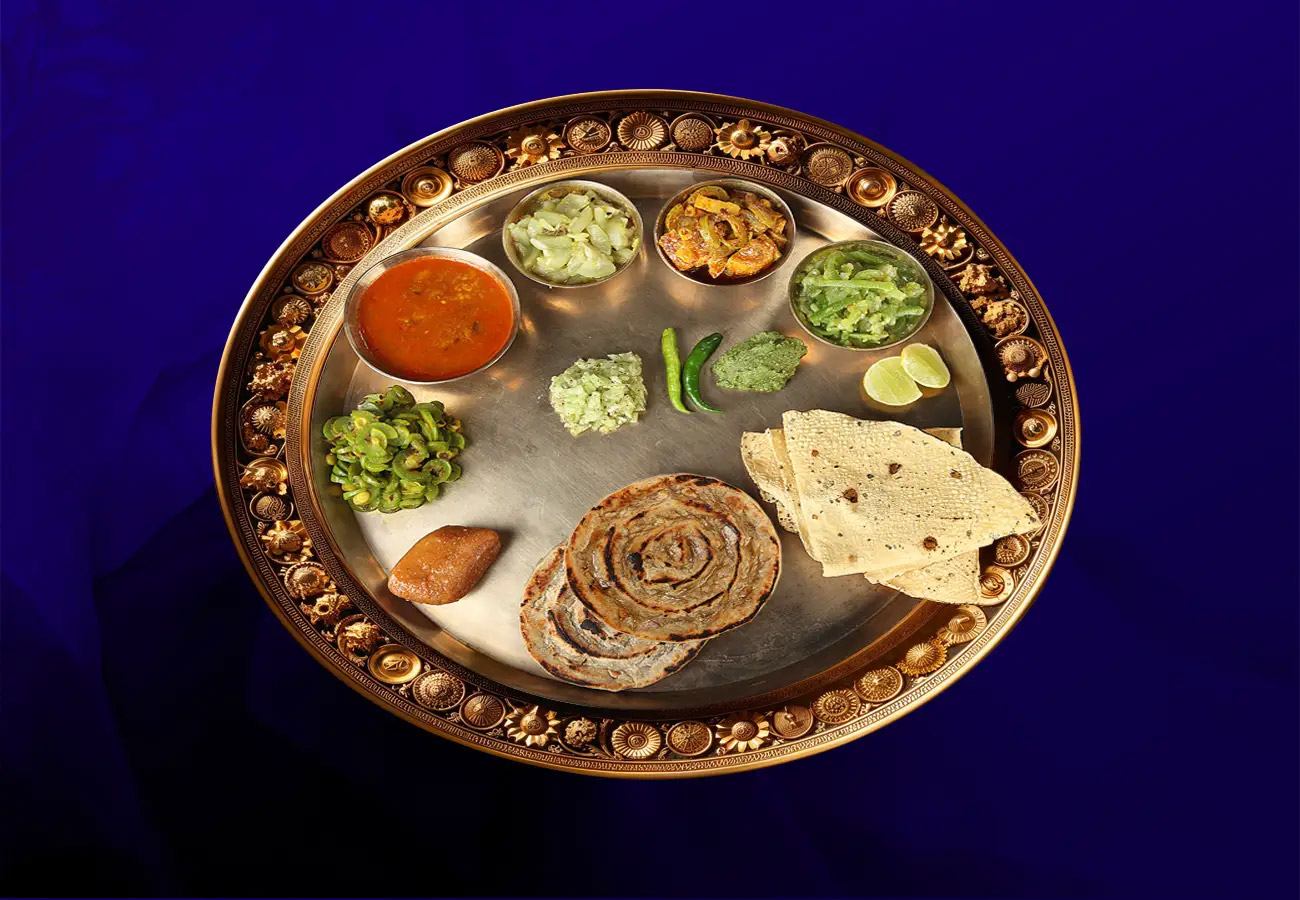 Close-up of a royal Sheherwali thali featuring a medley of traditional main course dishes including Boraphali ka Tarkari, Bhindi ka Ankra, Dahi ka Hola, and more at House of Sheherwali in Azimganj