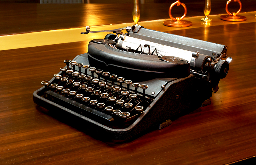 Exhibit image of a vintage typewriter at House of Sheherwali Hotel in Azimganj, showcasing its historical role in revolutionizing communication.