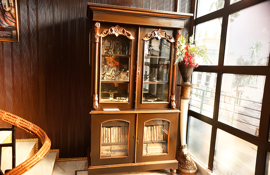 Exhibit of Victorian-era furniture at House of Sheherwali Hotel in Azimganj, featuring intricate woodwork and revivalist design.
