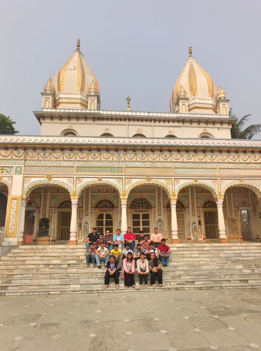 School group seated on the steps of the Adinath Jain temple at Kathgola Palace, Murshidabad