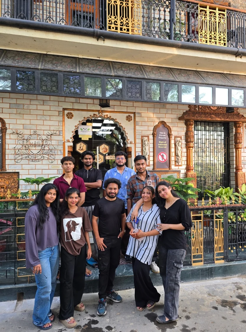 School students and guides outside a restored Sheherwali haveli during a heritage walk in Azimganj