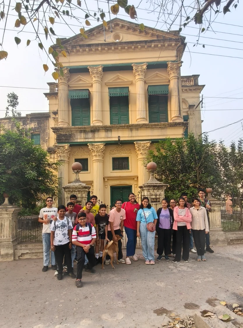 School students on a heritage walk outside a 19th-century Corinthian-column Sheherwali mansion in Jiaganj-Azimganj
